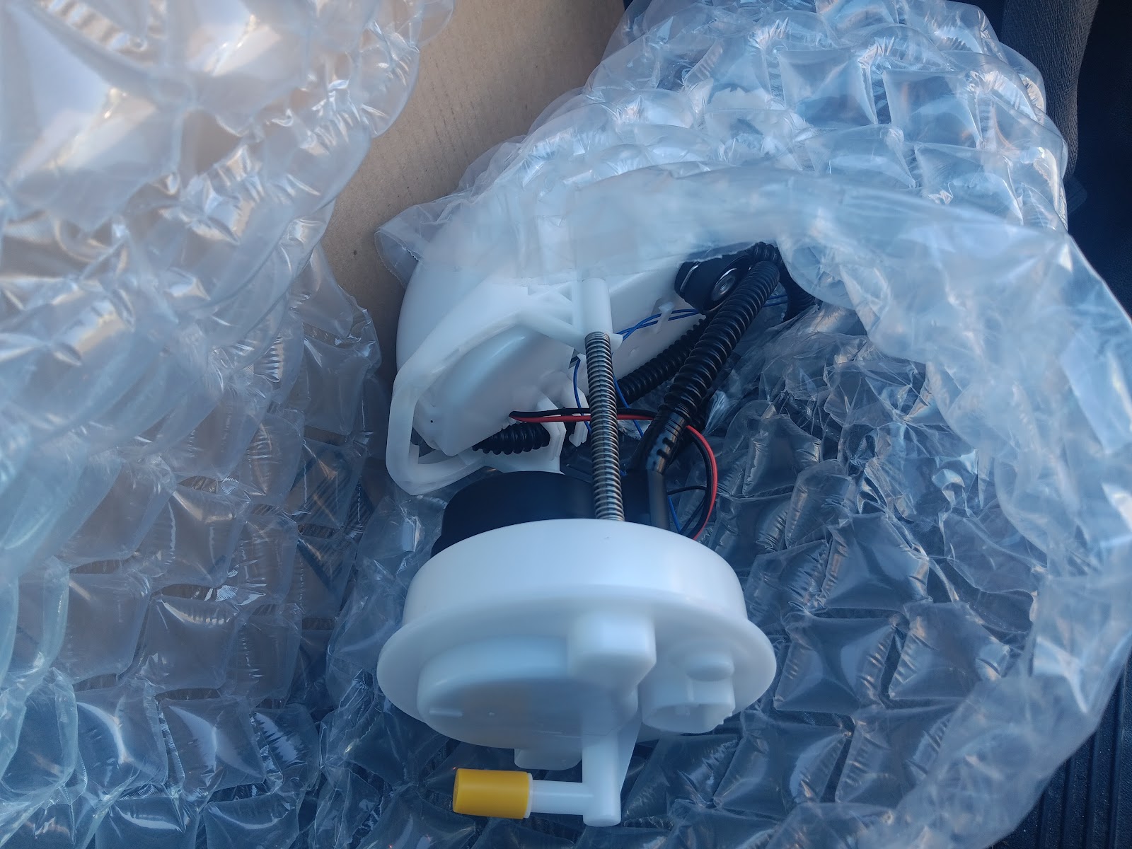 New fuel pump assembly still in bubble wrap packaging